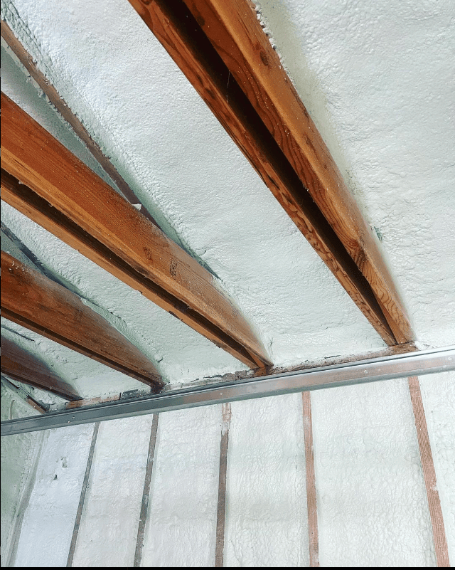 spray foam installaion on ceiling with beams